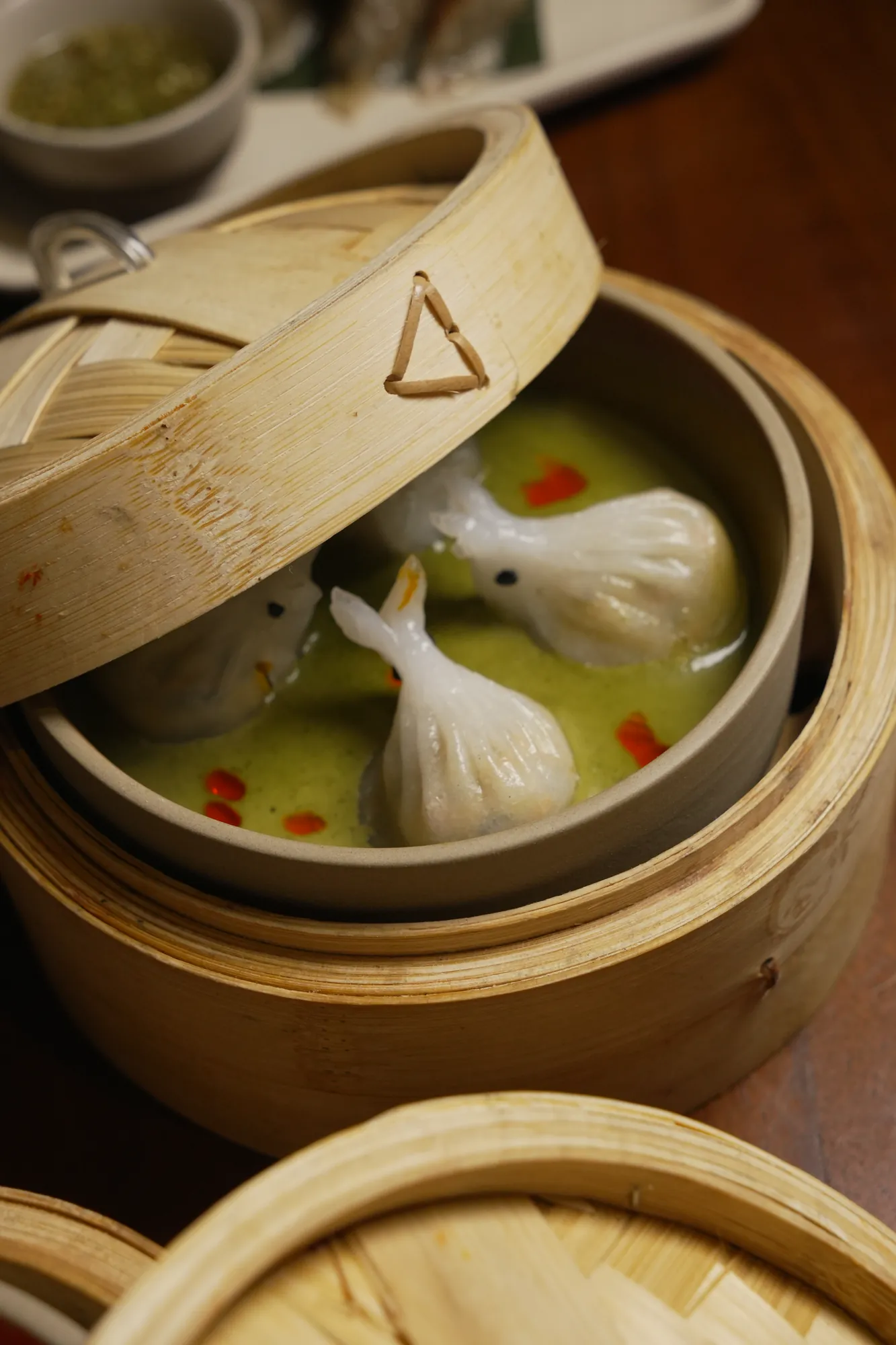 Green Curry Dumplings — rabbit-shaped, in a bamboo steamer