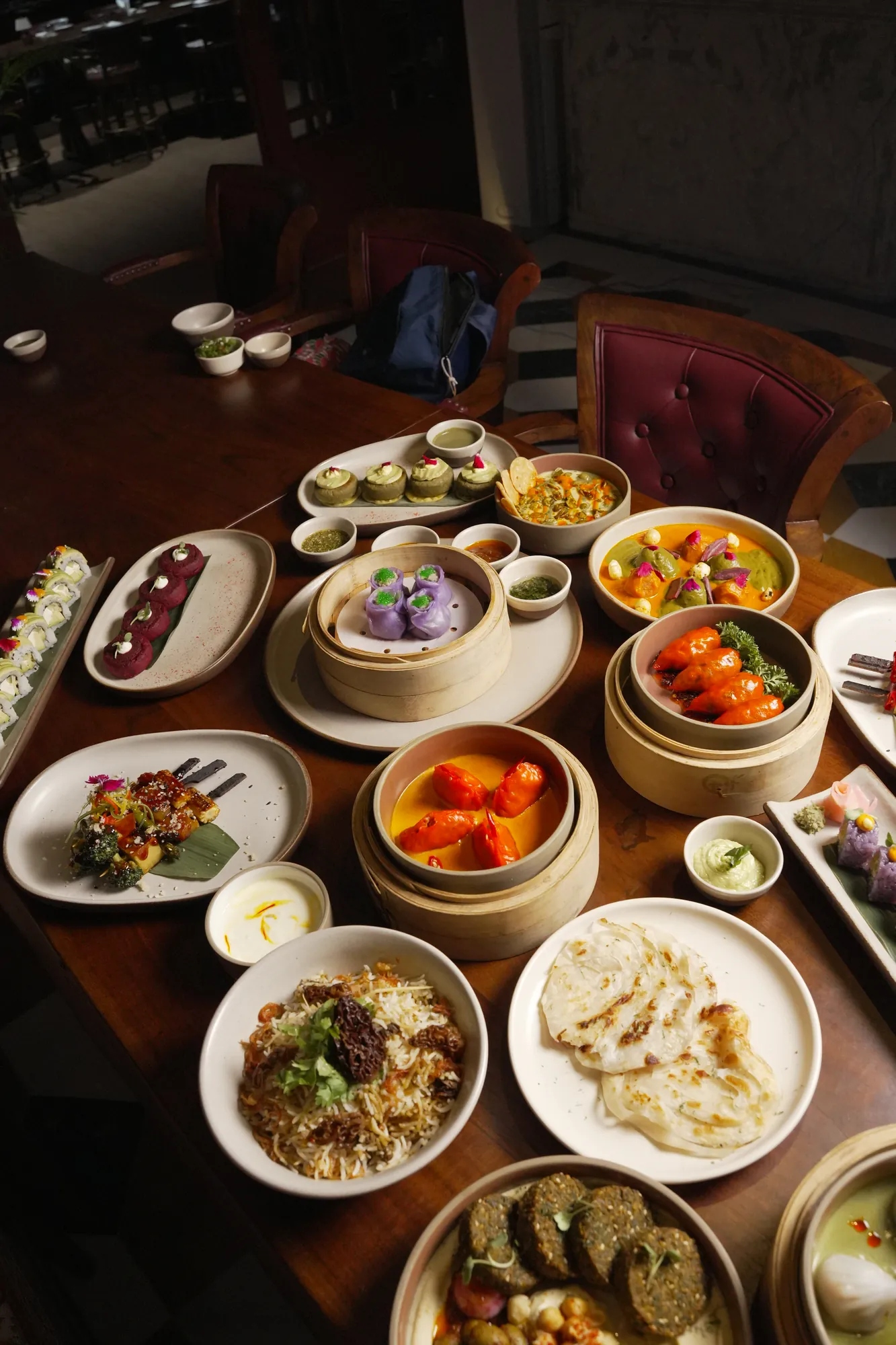 The Sawai table — dumplings, sushi, biryani and small plates