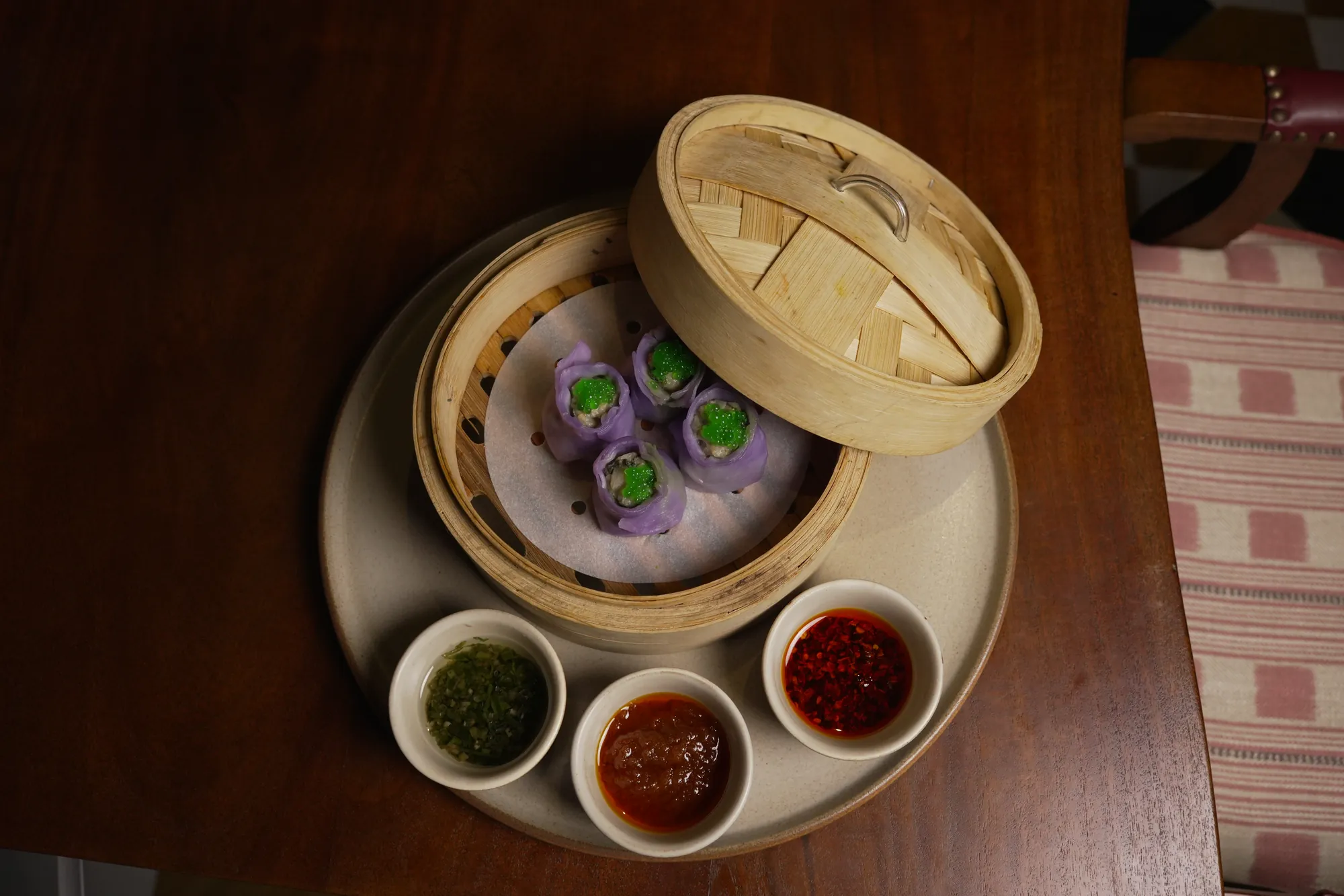 Seasonal dumplings in bamboo, with the house dipping sauces
